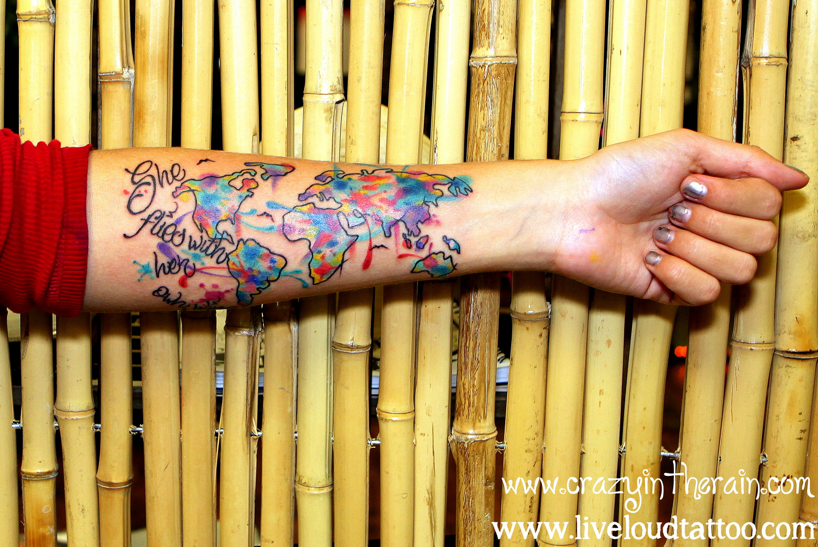 She Flies With Her Own Wings - Colorful World Map Tattoo On Forearm