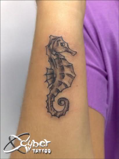 Simple Black Ink Seahorse Tattoo Design For Arm
