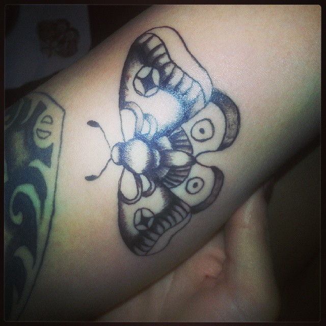 Simple Grey Moth Tattoo On Bicep