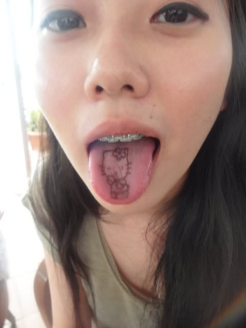 Simple Hello Kitty Tattoo On Girl Tongue