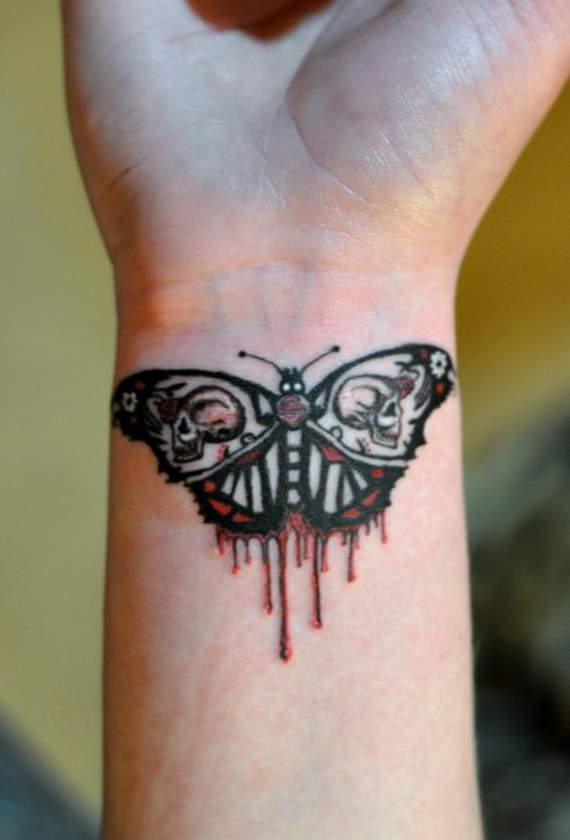 Simple Moth Tattoo On Right Wrist