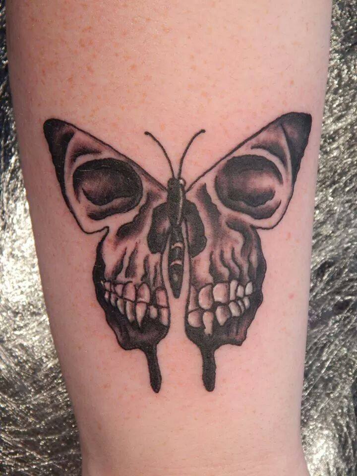 Skull In Moth Wings Tattoo On Bicep