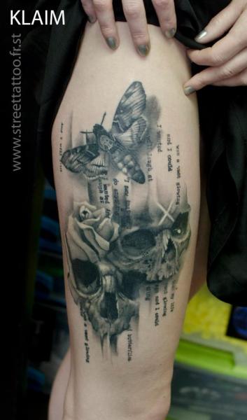 Skulls And Moth Tattoos On Thigh