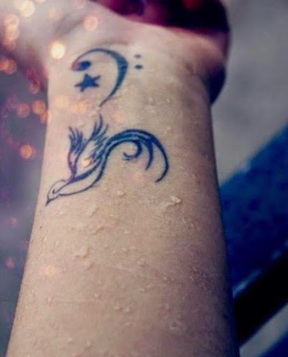 Star And Swallow Tattoo On Side Wrist