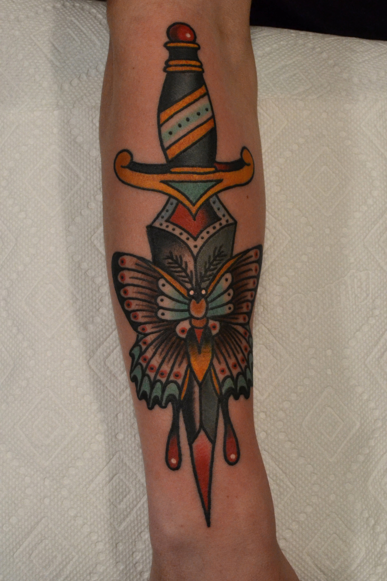 Traditional Dagger With Moth Tattoo Design For Forearm