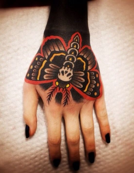 Traditional Moth Tattoo On Girl Hand