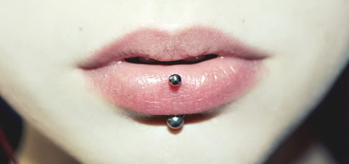 Vertical Silver Barbell Lip Piercing