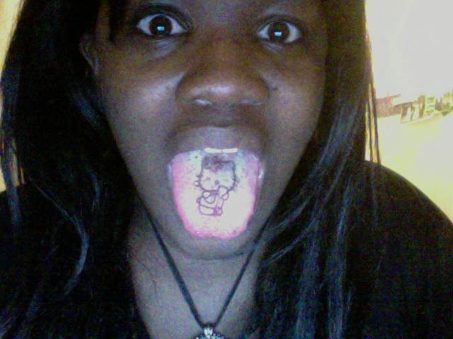 Wonderful Black Hello Kitty Tattoo On Girl Tongue