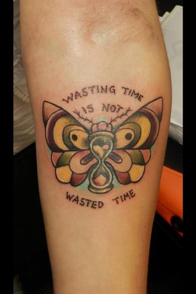 Simple Hourglass Moth Tattoo On Left Arm