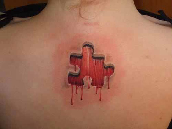 3D Puzzle Tattoo On Upper Back