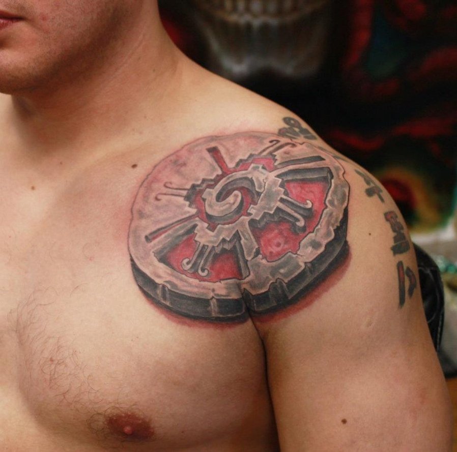 3D Stone Mayan Symbol Tattoo On Man Left Front Shoulder