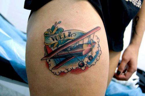 Airplane With Banner Tattoo On Thigh
