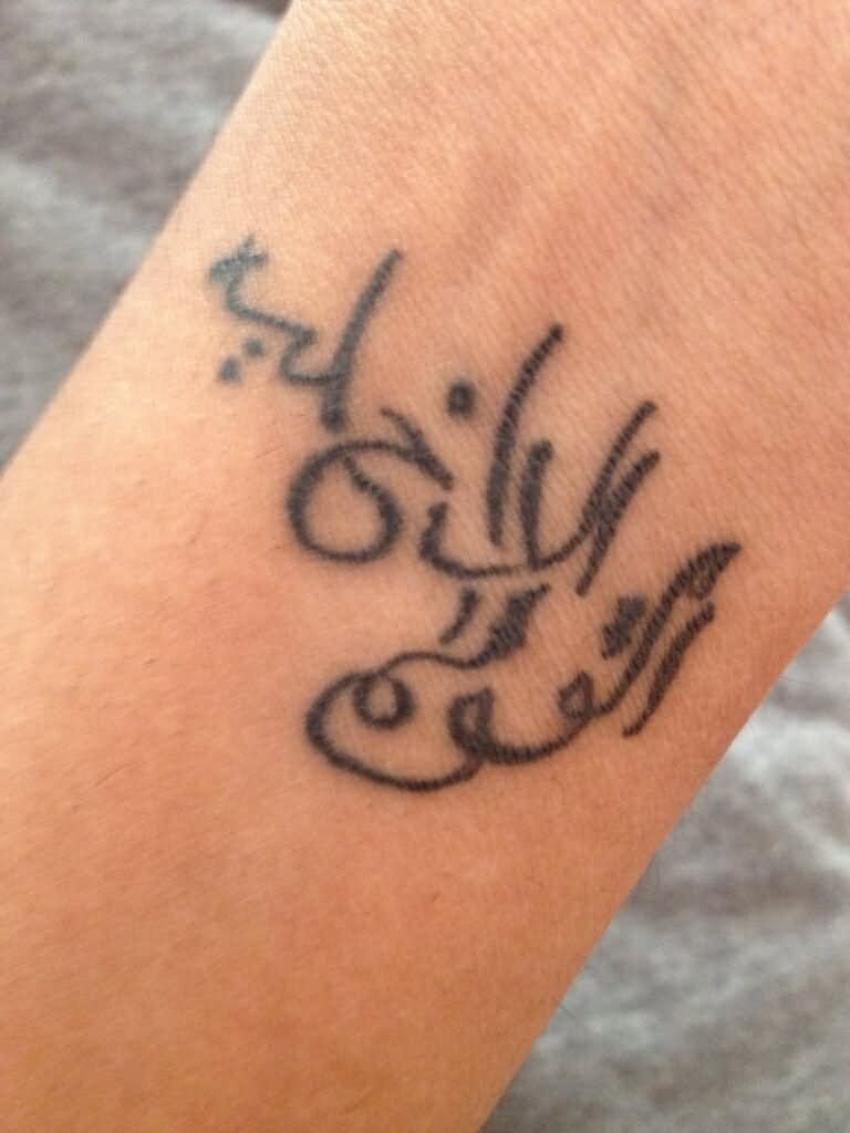 Amazing Grey Ink Arabic Tattoo On Wrist
