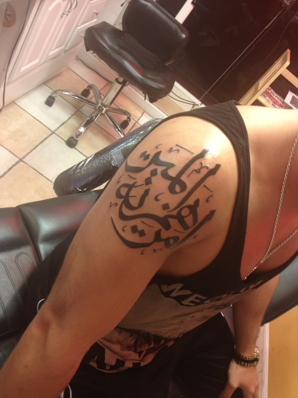 Arabic Tattoo On Girl Right shoulder
