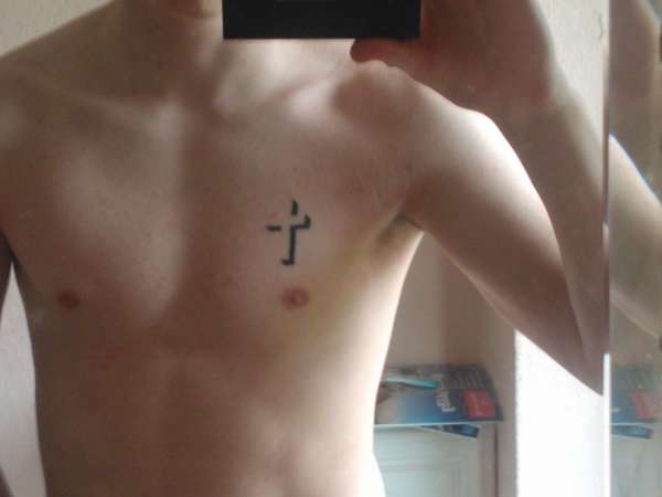 Black 3D Little Cross Tattoo On Man Chest
