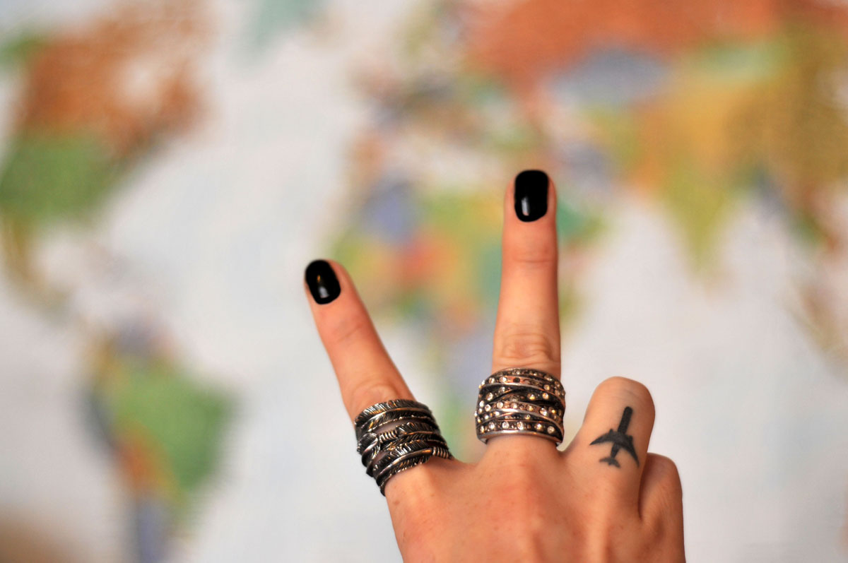 Black Airplane Tattoo On Girl Finger