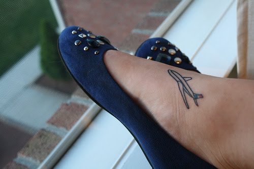 Black Airplane Tattoo On Girl Foot
