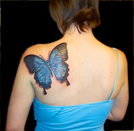 Black And Blue 3D Butterfly Tattoo On Girl Left Back Shoulder