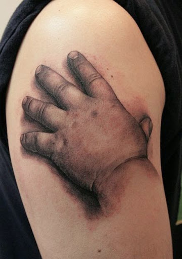 Black And Grey 3D Baby Hand Tattoo On Right Shoulder