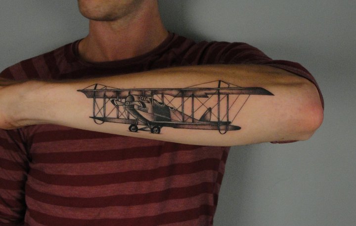 Black And Grey 3D Old Airplane Tattoo On Man Forearm