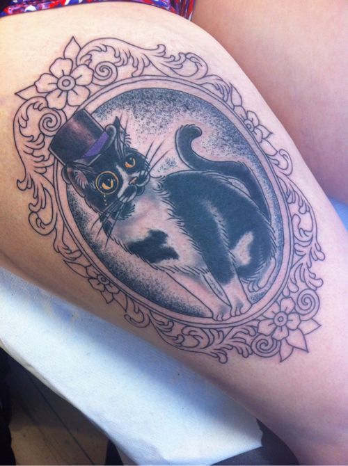 Black And Grey Cat In Frame Tattoo On Thigh