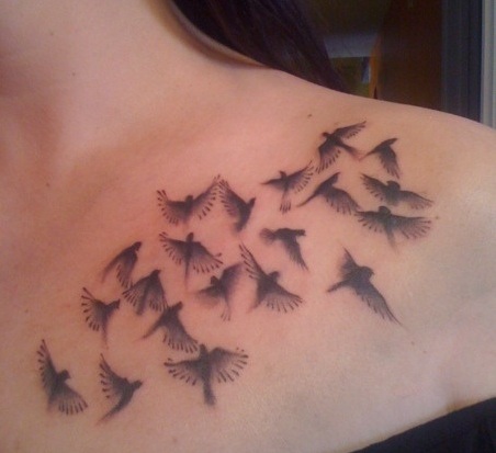 Black And Grey Flying Birds Tattoo On Left Front Shoulder