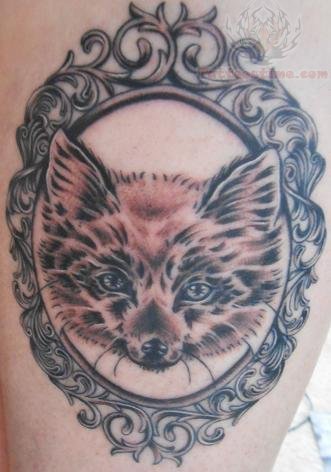 Black And Grey Fox Head In Frame Tattoo Design