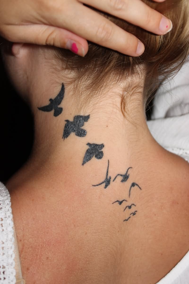 Black Flying Birds Tattoo On Girl Back Neck