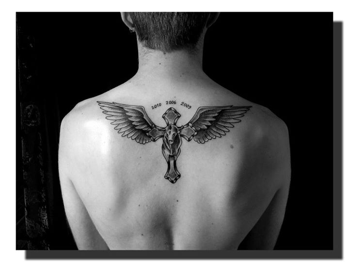 Black Ink 3D Cross With Wings Tattoo On Man Upper Back