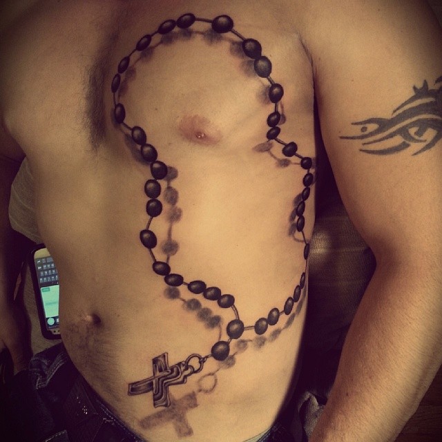 Black Ink 3D Rosary Cross Tattoo On Man Side Rib