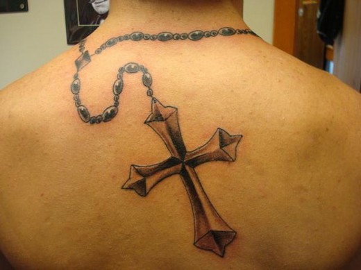 Black Ink 3D Rosary Cross Tattoo On Upper Back
