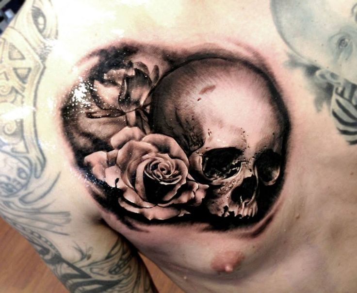 Black Ink 3D Skull With Rose Tattoo On Man Chest