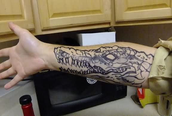 Black Ink Alligator Head Tattoo On Forearm