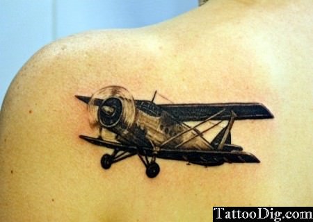 Black Ink Old 3D Airplane Tattoo On Left Back Shoulder