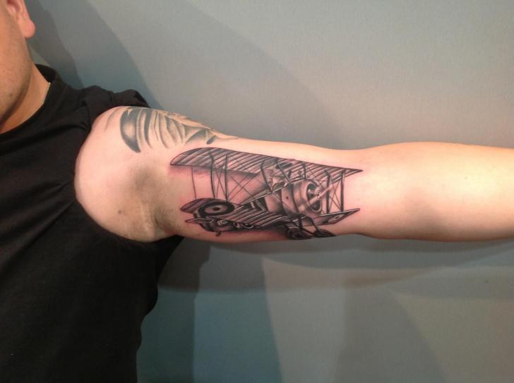 Black Ink Old Airplane Tattoo On Right Bicep