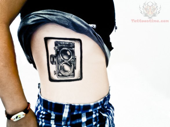Black Ink Old Camera In Frame Tattoo On Side Rib