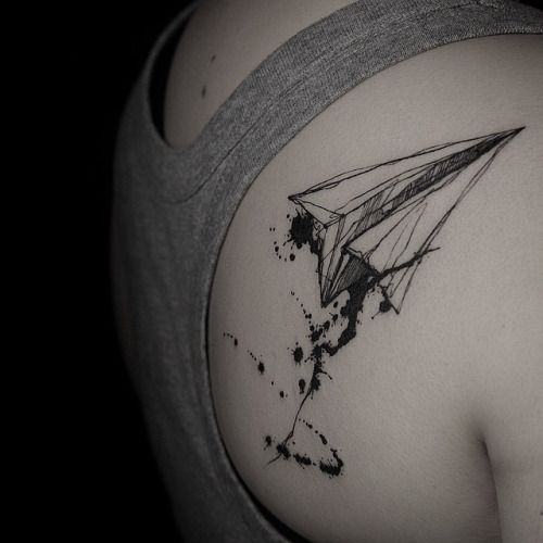 Black Ink Paper Airplane Tattoo On Right Back Shoulder