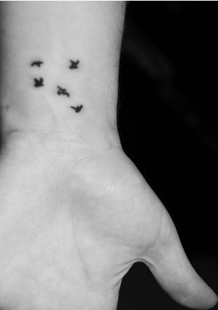 Black Ink Tiny Birds Tattoos On Wrist