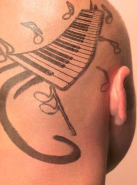 Black Keyboard With Music Knots Tattoo On Head