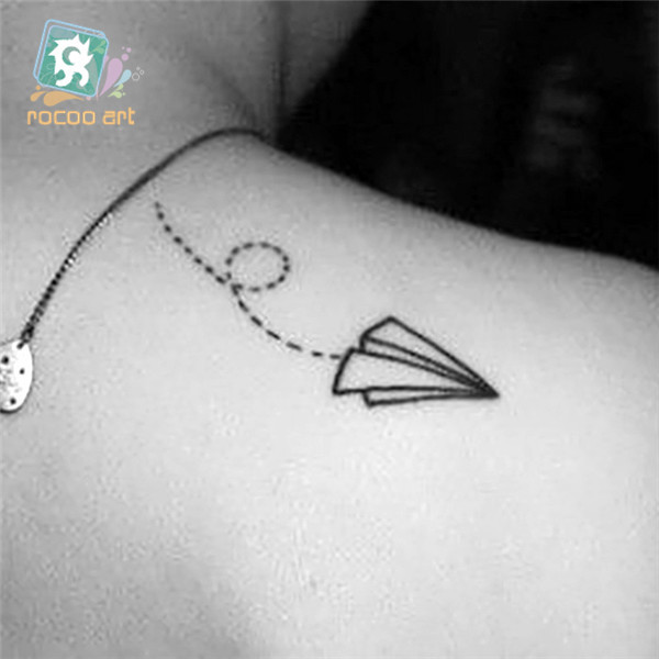 Black Outline Paper Airplane Tattoo On Right Upper Back