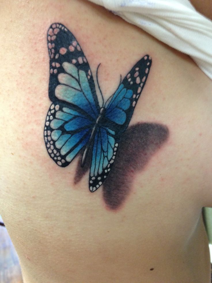 Blue And Black 3D Butterfly Tattoo On Girl Side Rib
