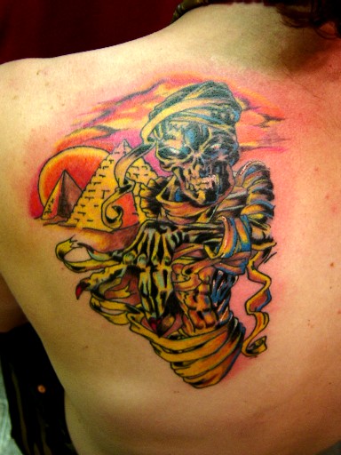 Color Ink Mummy Tattoo On Left Back Shoulder