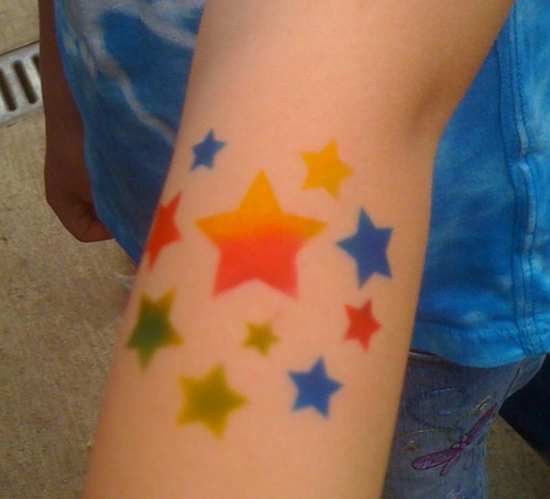 Colorful Airbrush Stars Tattoo Design For Arm