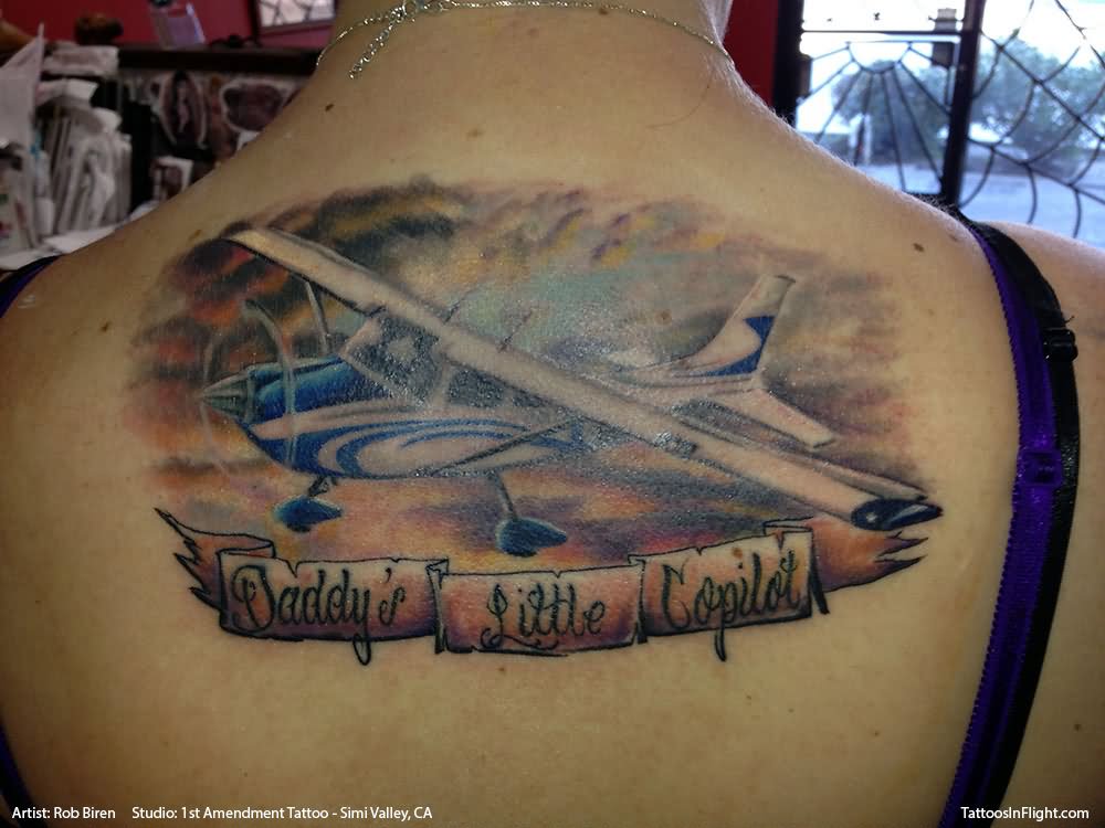 Colorful Airplane With Banner Tattoo On Upper Back
