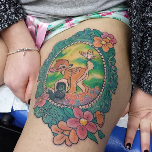Colorful Bambi With Butterfly In Frame Tattoo On Thigh