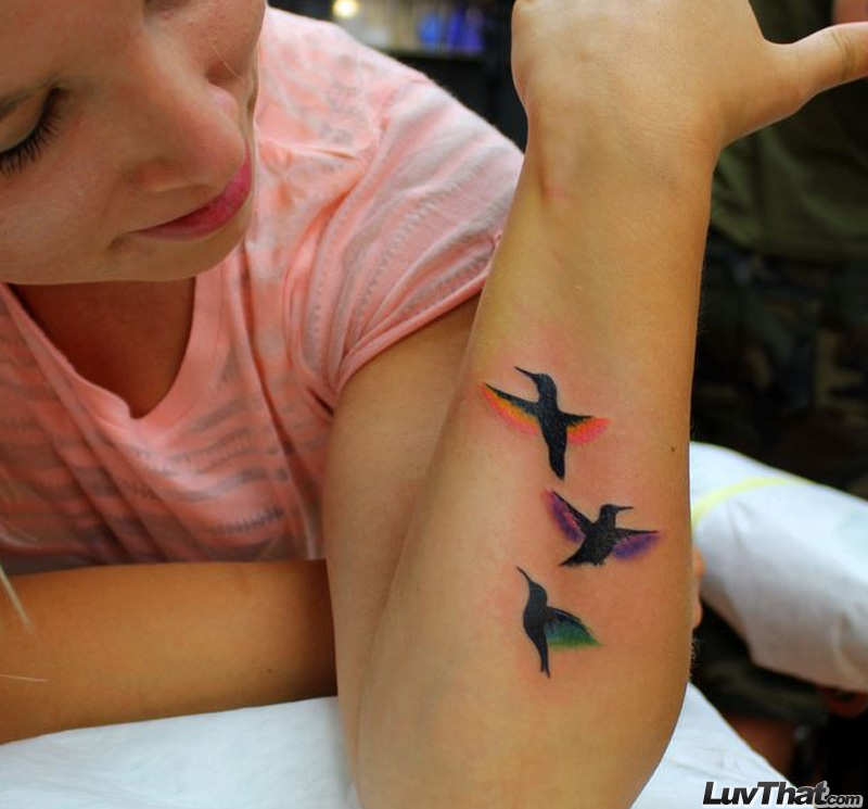 Colorful Flying Birds Tattoos On Wrist