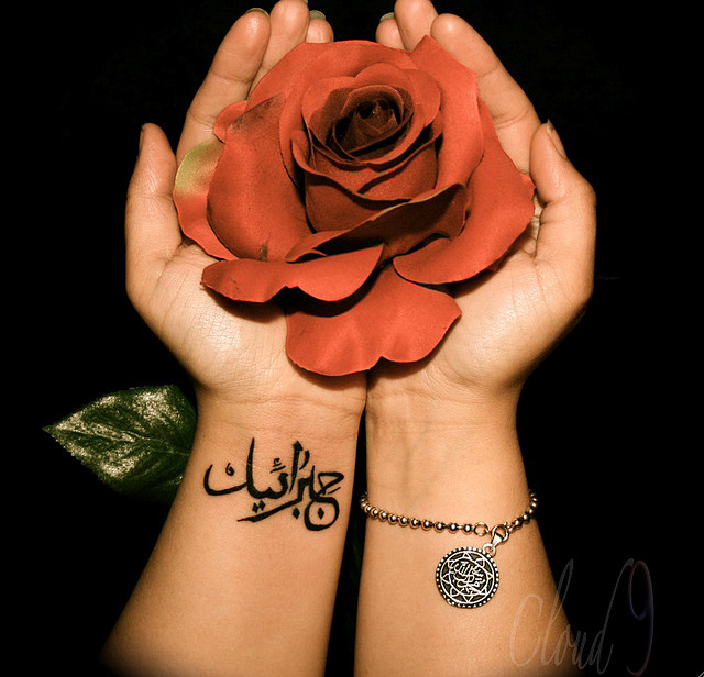 Cute Arabic Tattoo On Girl Left Wrist