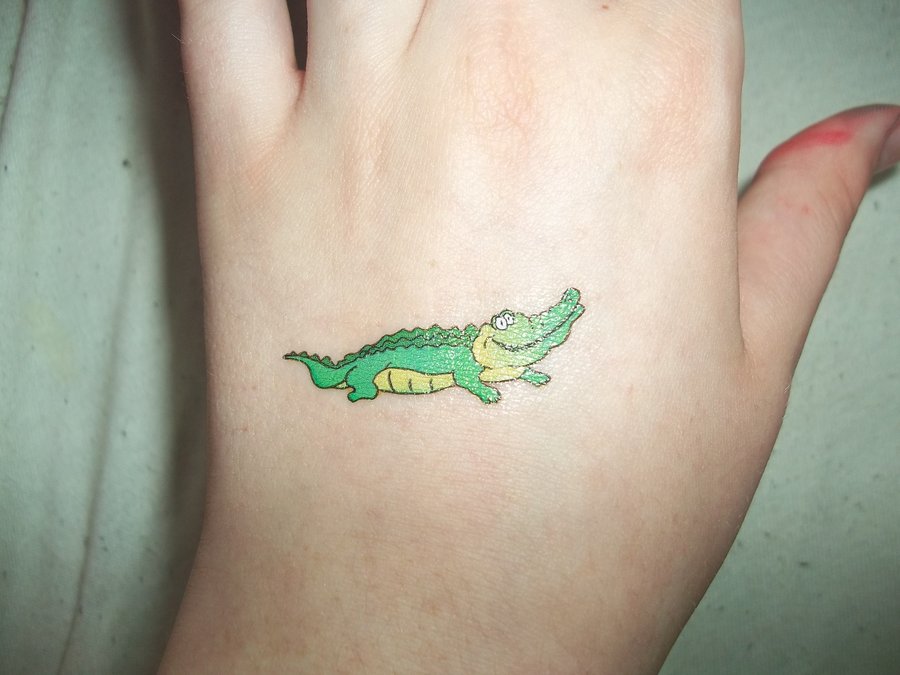 Cute Cartoon Alligator Tattoo On Hand By Anthamiala