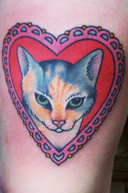 Cute Cat Head In Heart Frame Tattoo Design