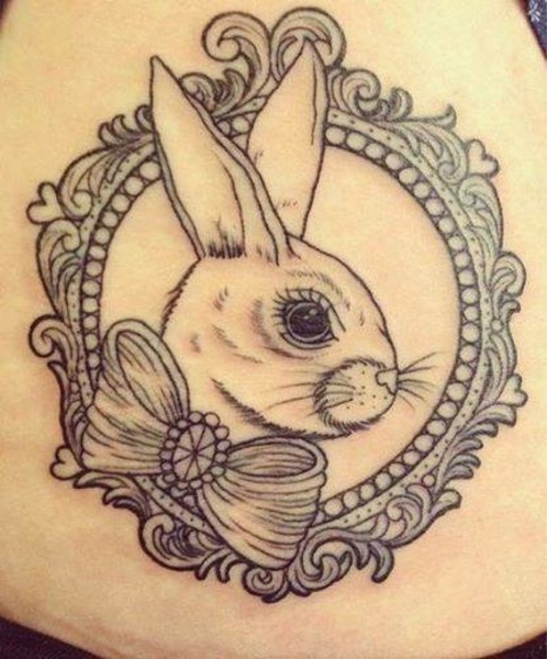 Cute Rabbit Head With Bow In Frame Tattoo Design